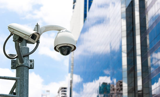 istock CCTV camera or surveillance operating with galss building in bac 513886281