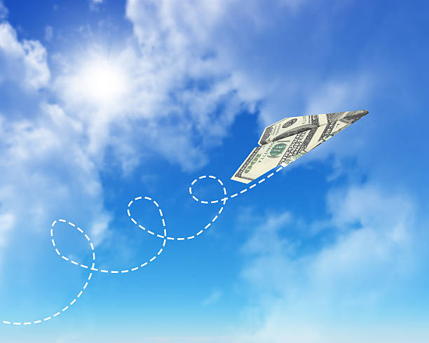 istock Paper airplanes made of hundred dollar bills 513886857