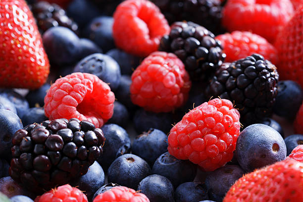 istock strawberries, blueberries, raspberries and black berries. 513890202