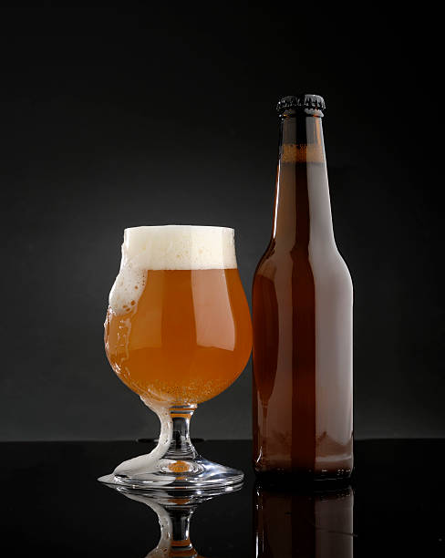 istock glass of beer with bottle 513890498