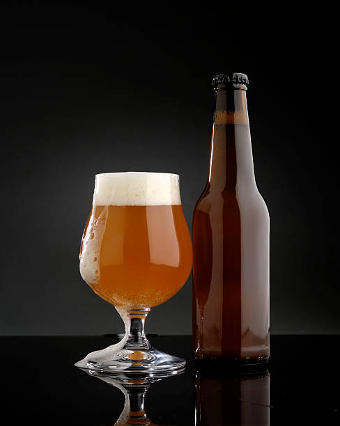 istock glass of beer with bottle 513890784
