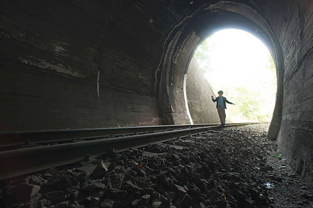 istock Child walking in railway tunnel 513893122