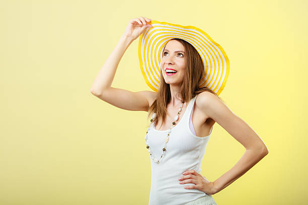 istock Woman in big yellow summer hat. 513893150