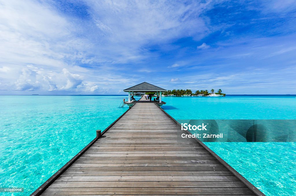 Boardwalk to paradise Boardwalk to a beach paradise Maldives Stock Photo