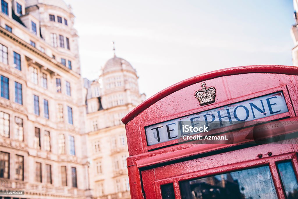 Telephone Booth Telephone booth in streets of London. Old buildings in background. Box - Container Stock Photo