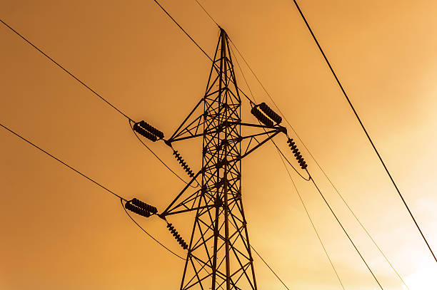 istock Silhouette of high voltage power lines 513894772
