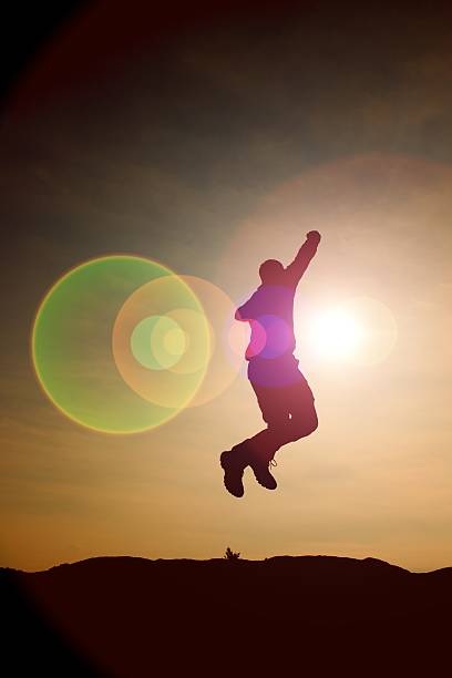 istock Jumping young crazy  man jump on colorful sky background. 513894930