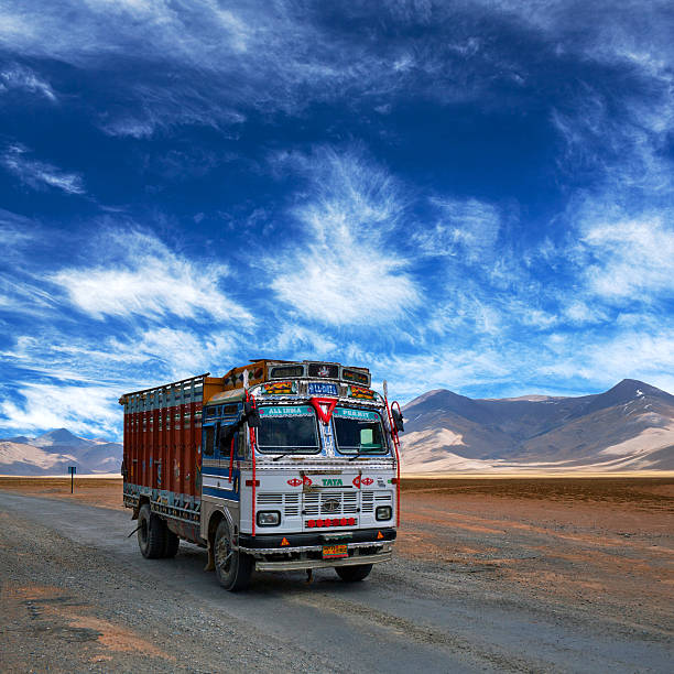 Truck driving on Manali - Leh National highway, India Ladakh, India - June 10, 2012: Indian truck driving in the Indian Himalayas on Manali - Leh National highway in Ladakh, Jammu and Kashmir state, North India. Indian and Pakistani truckers consider their vehicles as national symbols and make it a competition as to who has the most fabulous truck. karakoram range stock pictures, royalty-free photos & images