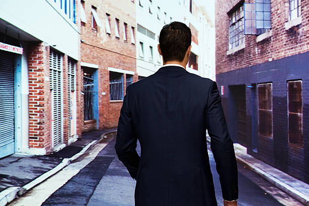 istock Rear view of  businessman walking 513900989