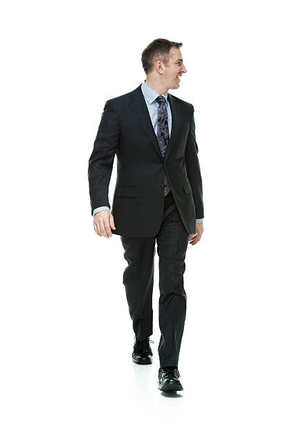 istock Cheerful businessman walking & looking away 513901005