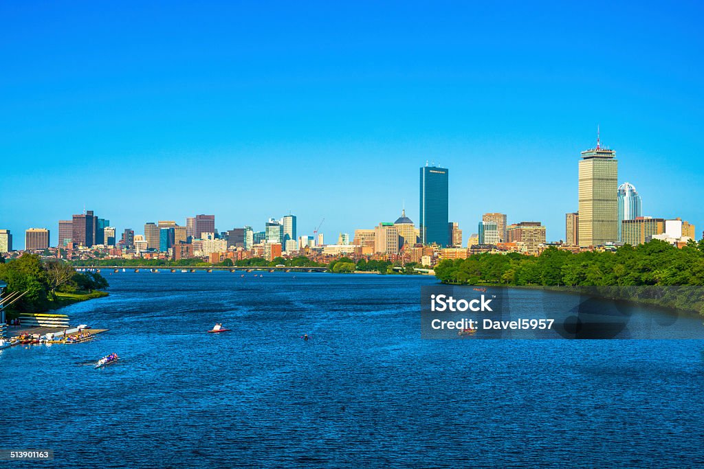 Boston city skyline Boston city skyline, with the Charles River and people in rowboats in the foreground. Boston - Massachusetts Stock Photo
