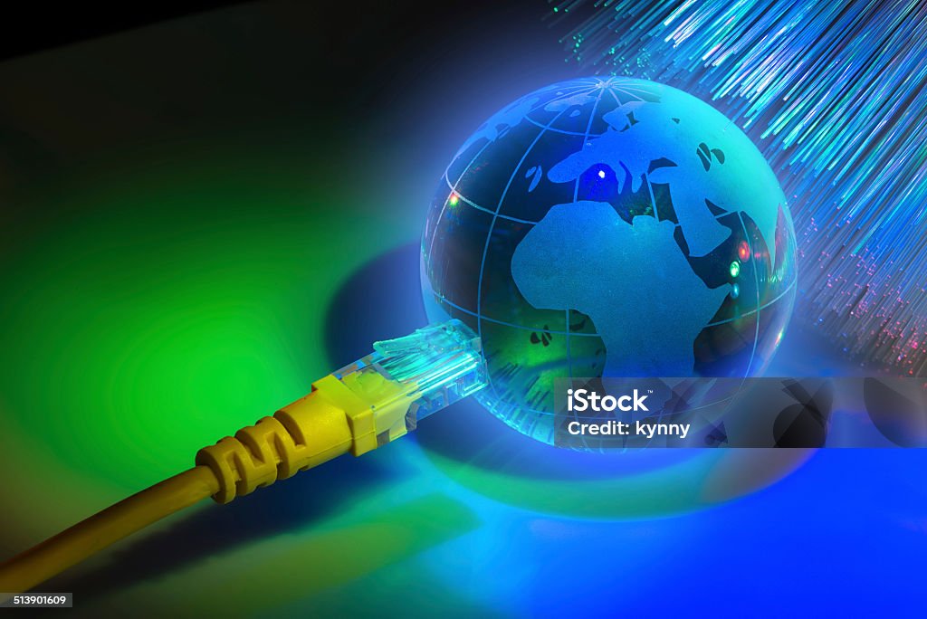 glass earth with network against fiber optic glass earth with network against fiber optic background Accessibility Stock Photo
