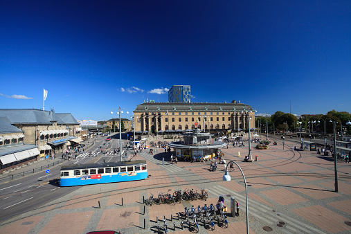 Gothenburg, Sweden - September 4, 2014: A tram passes through the Drottningtorget in Göteborg. The main square in front of the Central station is crowded through the day and is a main hub for tram public transport.