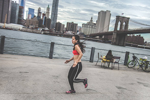 istock Young woman running in New York 513903213