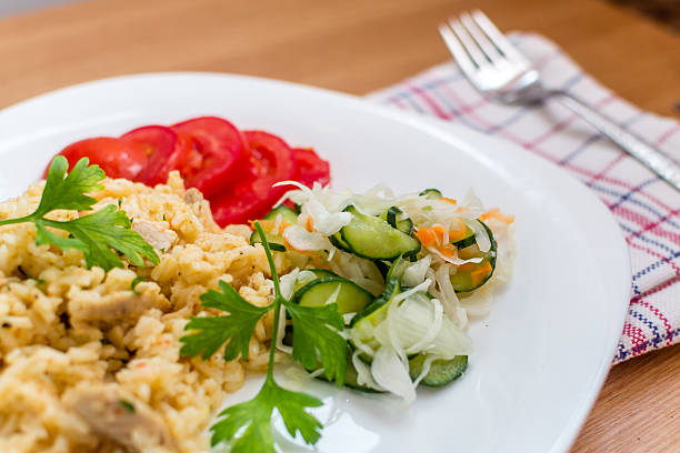 istock Delicious rice with pork meat and salad 513903373
