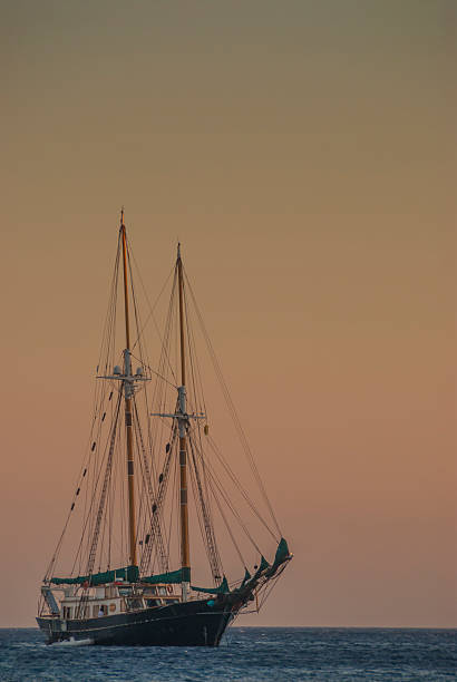 istock Sailing Boat Coming into Harbour at Sunset 513904313