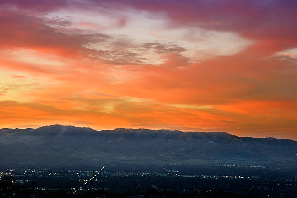 istock City Lights over a sunset background 513907357