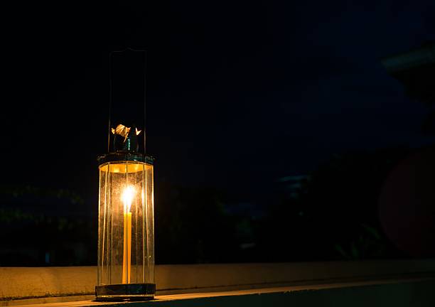istock Decagon glass lamp, candle light in the darkness. 513907507