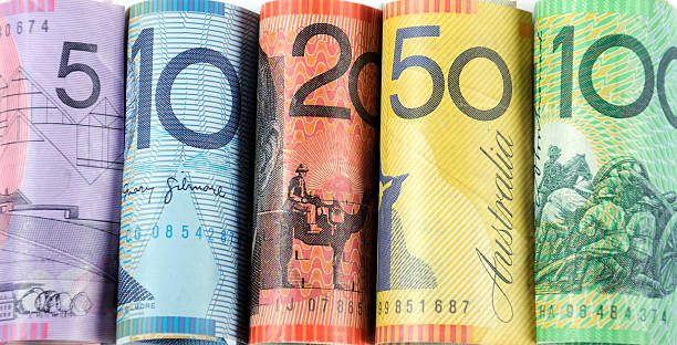 Rolls of Australian cash money notes. Rolls of Australian cash money with five, ten, twenty, fifty and one hundred dollar notes. downunder stock pictures, royalty-free photos & images