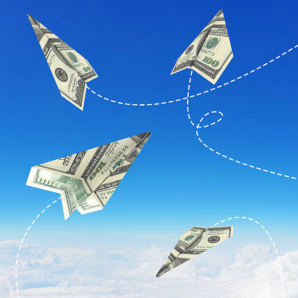 istock Paper airplanes made of hundred dollar bills 513918441