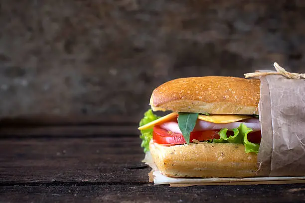 Photo of Sandwich on wooden background