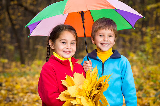 istock Two kids in autumn forest 513920277