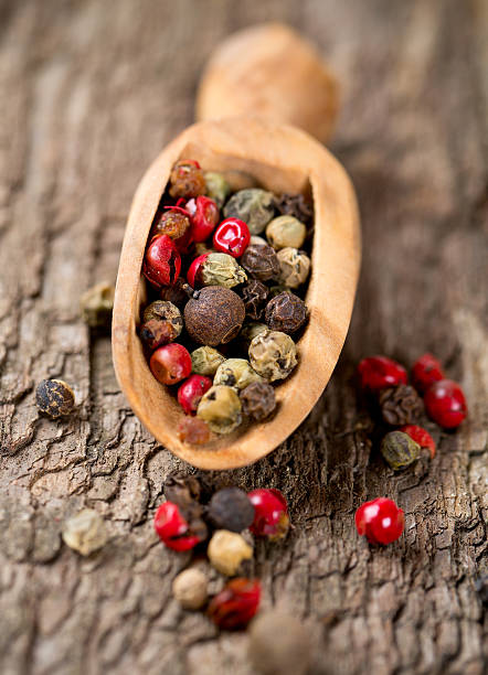 istock color pepercorns in a wooden scoop 513921241