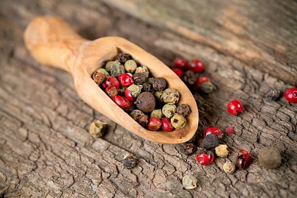 istock color pepercorns in a wooden scoop 513921243
