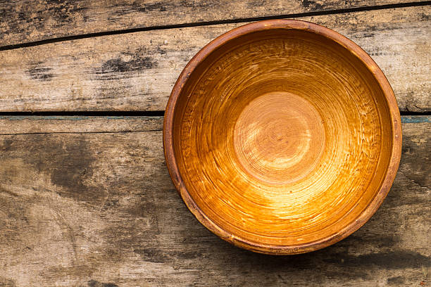 istock Ceramic bowl on wood background. Top view 513921283