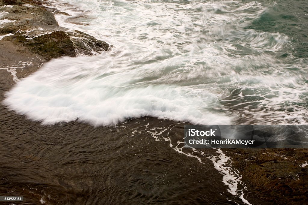 Wave of white caps in Jan Mayen crashing along a rocky coast Raw sea in Jan Mayen norwegian sea Norway Beauty Stock Photo