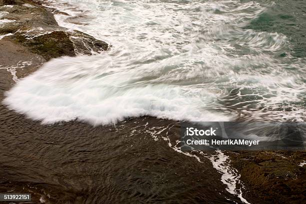 Wave Of White Caps In Jan Mayen Crashing Along A Rocky Coast Stock Photo - Download Image Now