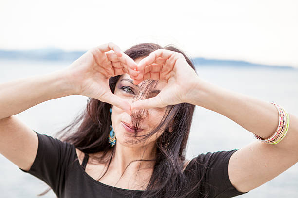 istock Woman Brunette making Heart Shape 513922705