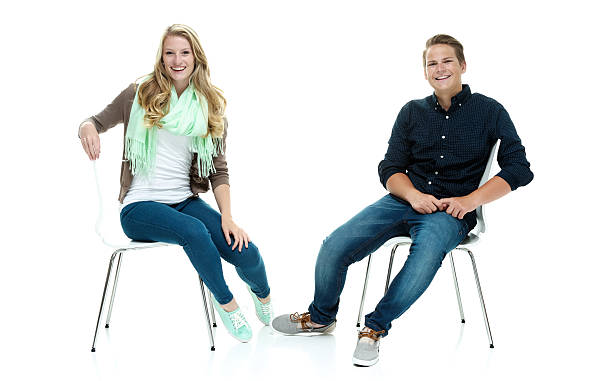 istock Cheerful couple on chair & looking at camera 513923053