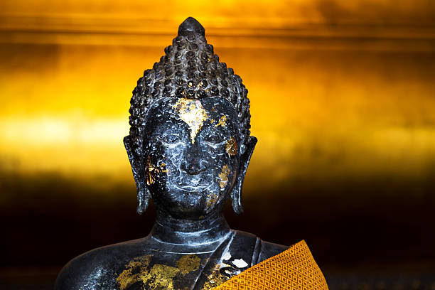 istock ancient buddha sculpture detail 513923229
