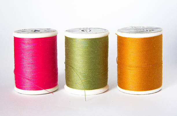 istock bobbins of thread isolated on white 513923815
