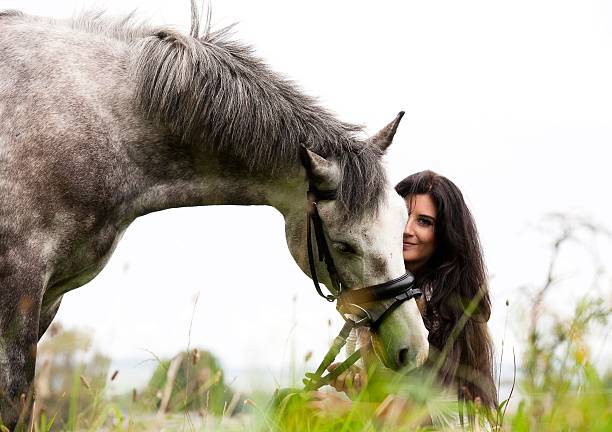 istock Young woman with her horse 513923887
