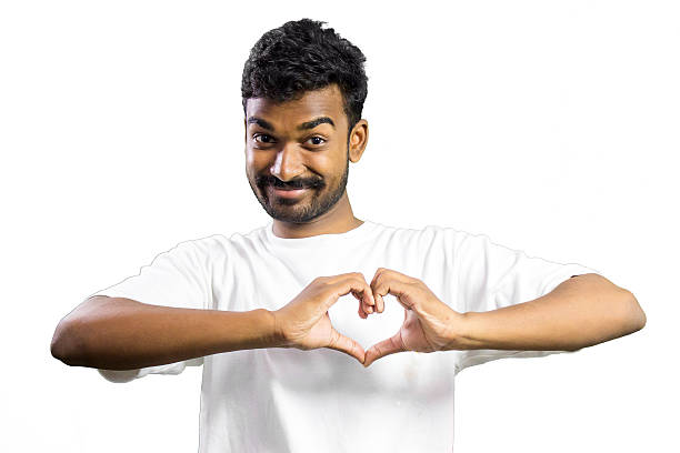 istock Cheerful man making a heart symbol with hands. 513924383