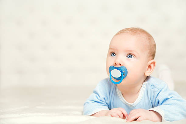 Baby in Blue Bodysuit, Kid Boy Lying Down