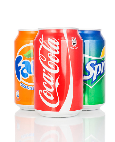 Kragujevac, Serbia - January 19, 2016: Can of Coca Cola, Fanta and Sprite isolated on white background. Coca-Cola company made carbonated soft drink. 