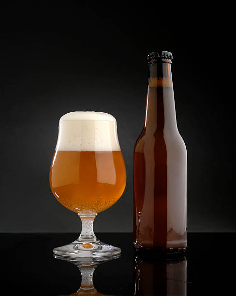 istock glass of beer with bottle 513938044