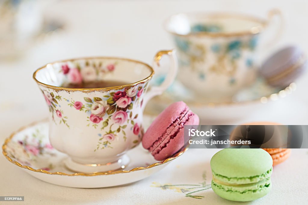 Cup of Tea with macaroons Two cups filled with tea and some macaroons Afternoon Tea Stock Photo