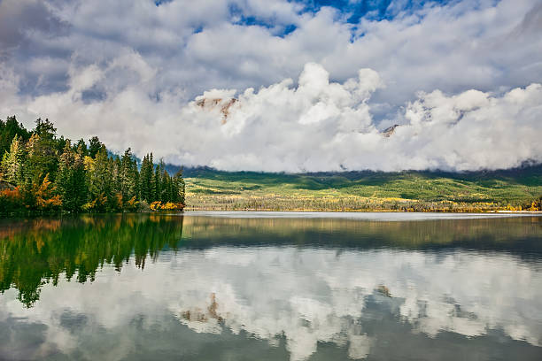 istock Picturesque clouds are reflected in water 513941410