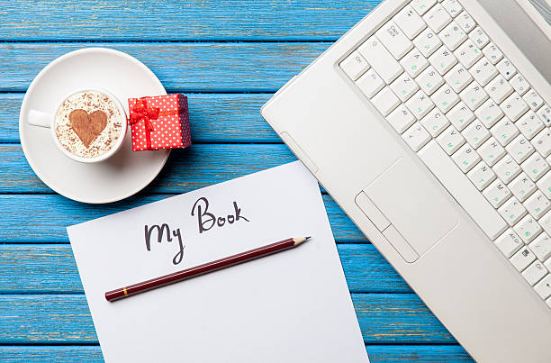 istock paper, gift, coffee and laptop lying on the table 513944434