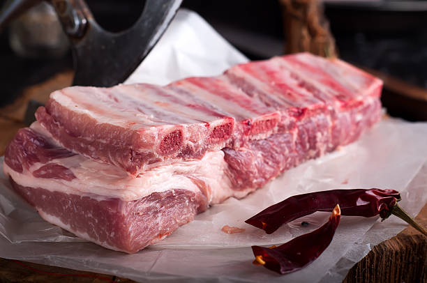 istock Raw ribs  on a  wooden table 513946820