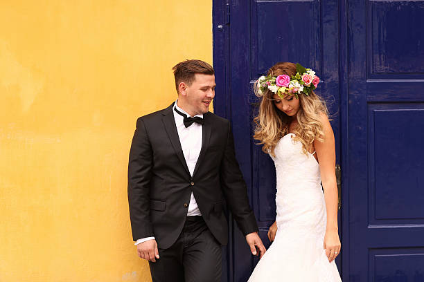 istock bride and groom posing in the city 513947256