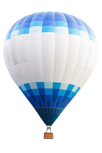 Colorful hot air balloon with rainbow color soaring in the sky,cloud with blue sky in the background,view from low angle