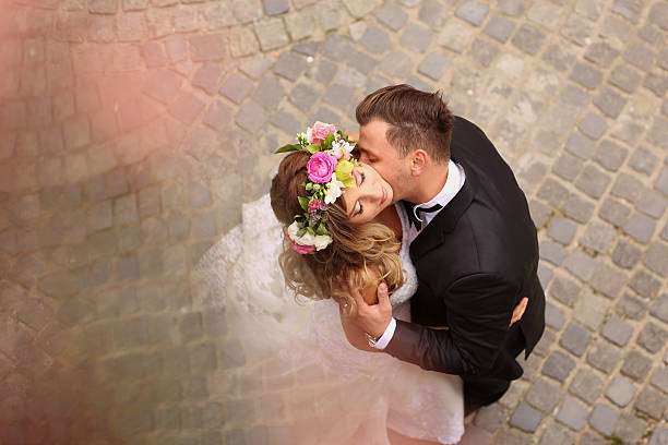 istock bride and groom posing in the city 513947456