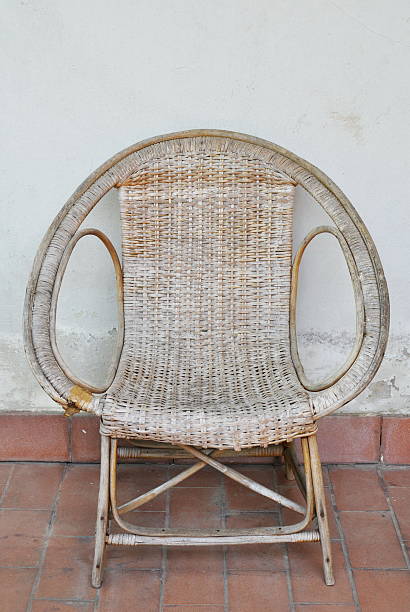 istock rattan chair on white wall 513947544