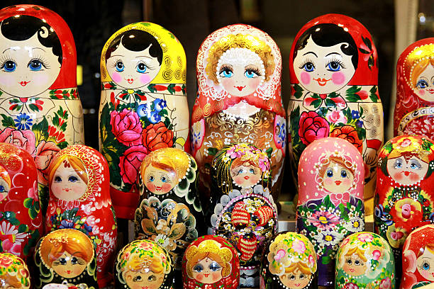 istock Russian toy matrioska dolls in row as a background 513947680