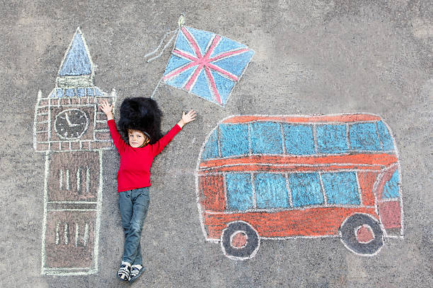 istock kid boy in british soldier uniform with London chalks picture 513948510